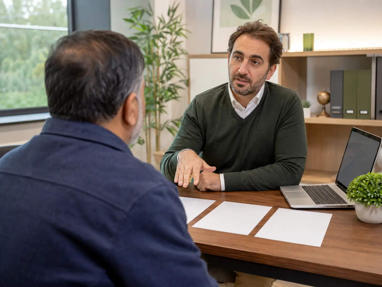 A customer receiving calm, private application guidance from an adviser